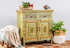 Side angle image of a hand painted green Indian cabinet made from recycled wood with floral motifs, 2 drawers and 2 compartments, 90 × 90 × 40 cm.
