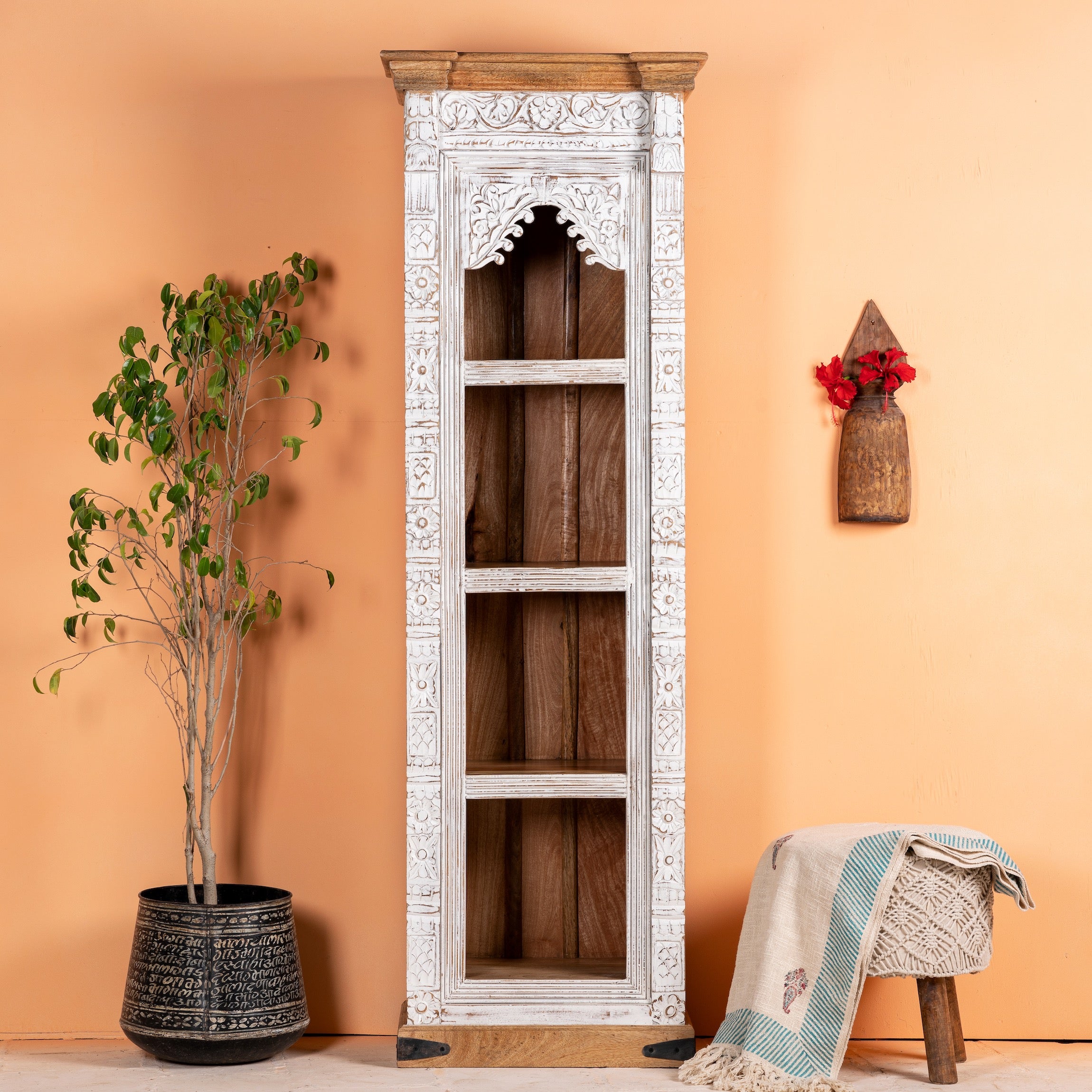 Hand carved white washed mango wood bookshelf with Mediterranean design – narrow wooden furniture piece with decorative carving and natural charm.