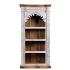White background image of a hand-carved mango wood bookshelf with arched frame and whitewashed finish – carved wooden furniture and mango wood shelving with Indian-inspired design.